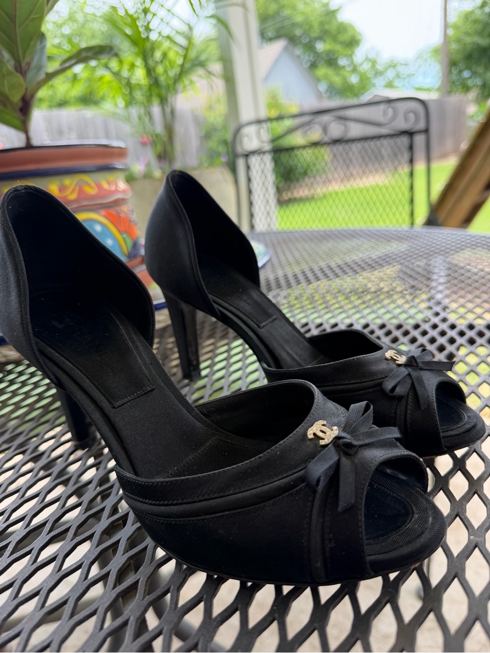 CHANEL Black Open-Toe D'Orsay Heels with Bow and Gold CC Accent